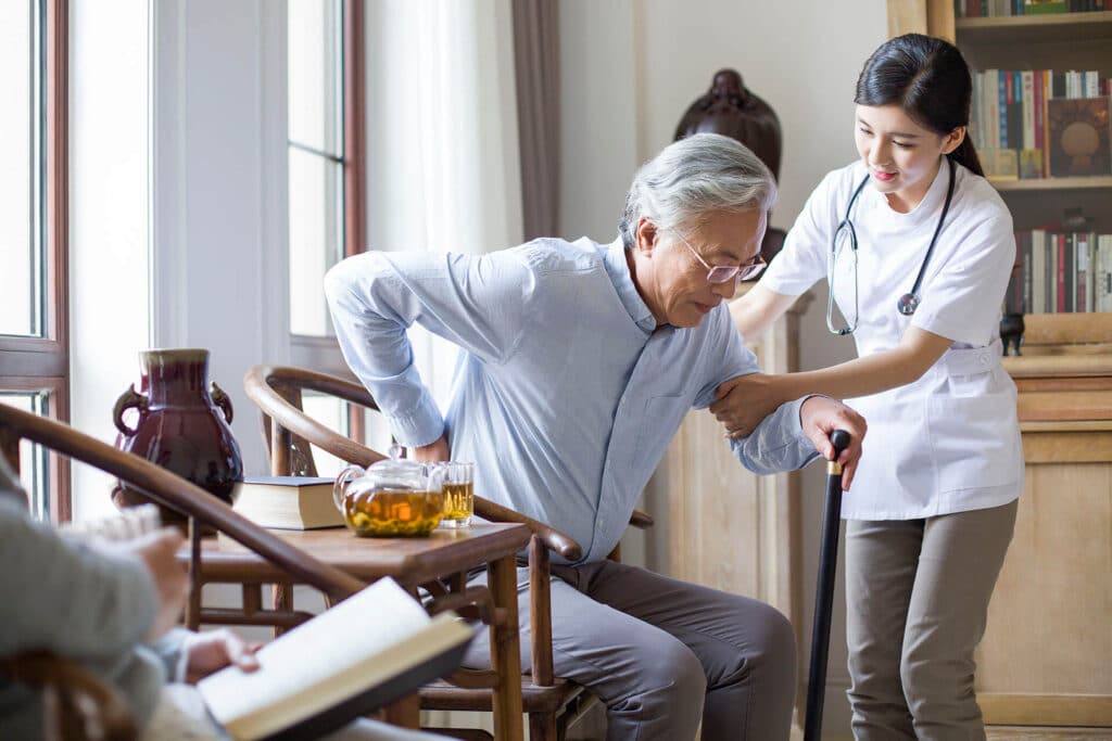 nursing assistant taking care of senior man- ageism
