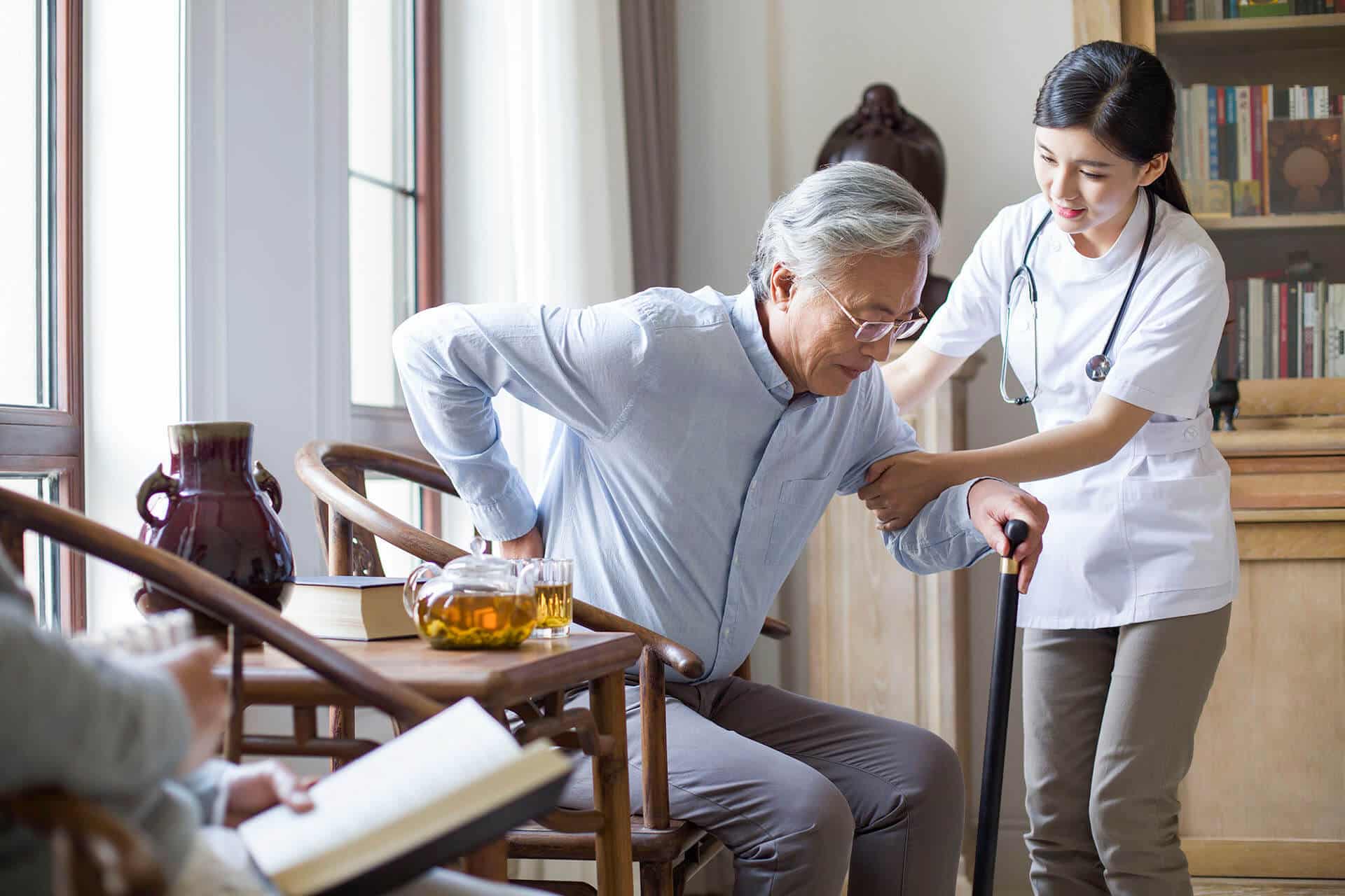 nursing assistant taking care of senior man- ageism